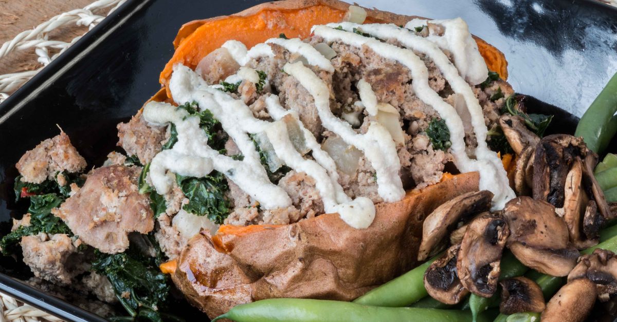 Baked Sweet Potatoes with Spiced Puy Lentils and Tangy Tahini Drizzle