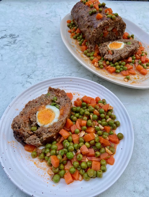 Dalyan Köfte (meatloaf with boiled eggs, peas and carrots in tomato sauce)