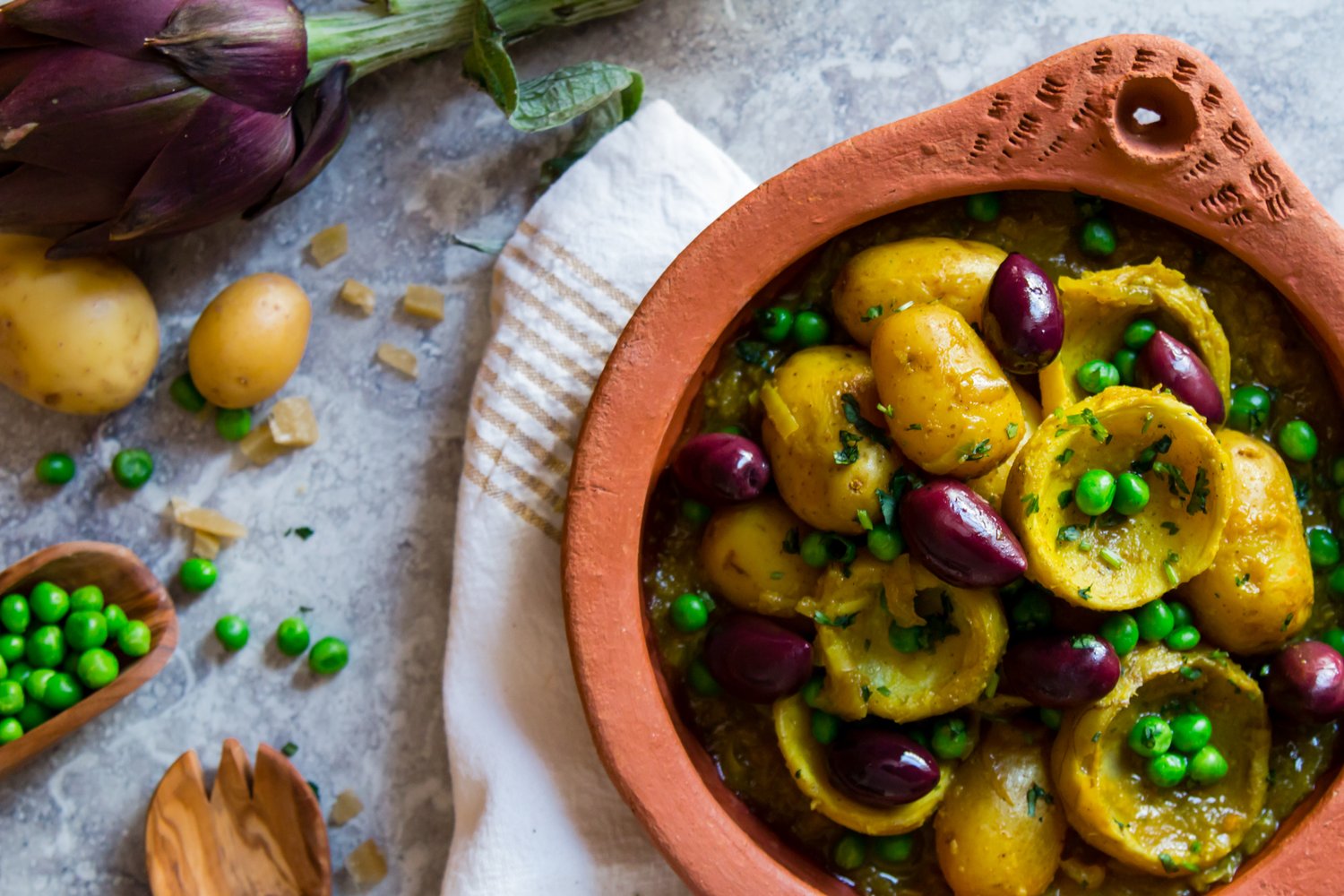 Artichoke tagine with peas, baby potatoes and preserved lemon (vegan)
