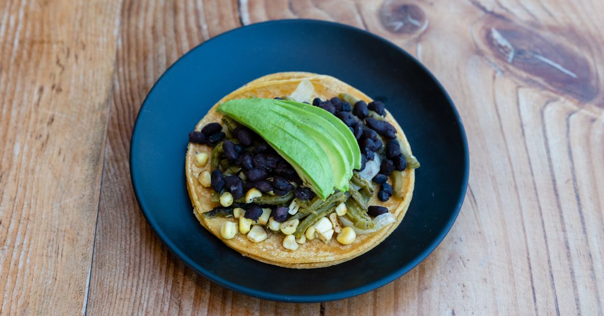 Mexican Black Bean Tostada Salad with Lime Crema and Crispy Tortilla