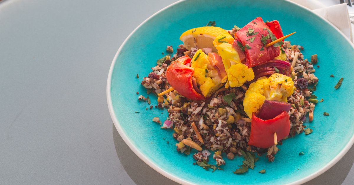 Peruvian Quinoa-Stuffed Peppers with Aji Verde Sauce