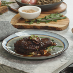Vegan steakhouse dinner with wine-glazed mushrooms, charred veggie demi, and creamy mashed potatoes