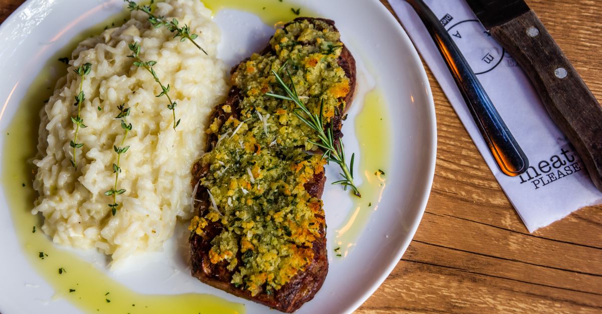 Italian Herb-Crusted Pork Chop with Creamy Polenta and Sautéed Greens