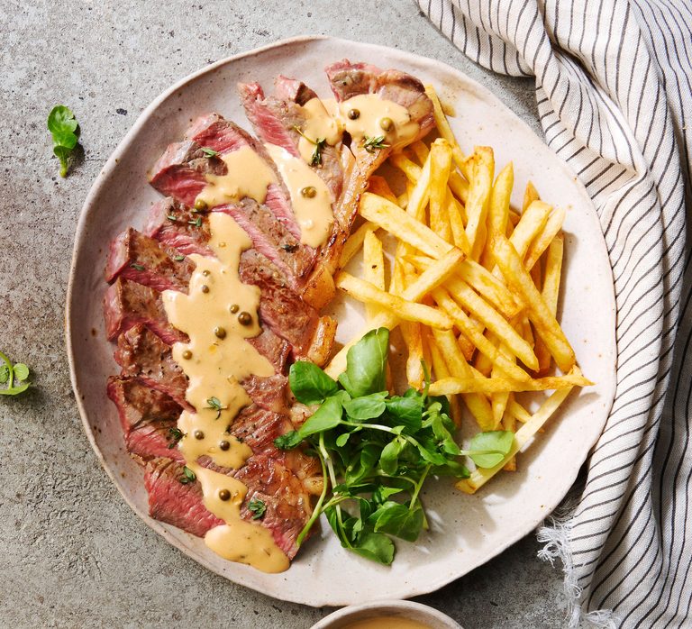 Next level steak frites with green peppercorn sauce