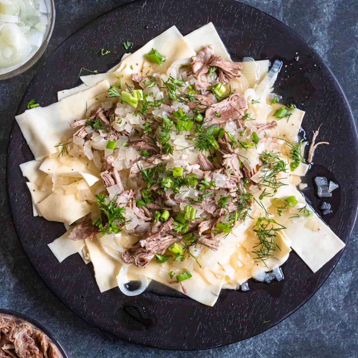 Beshbarmak with lamb, onion broth and lasagna noodles