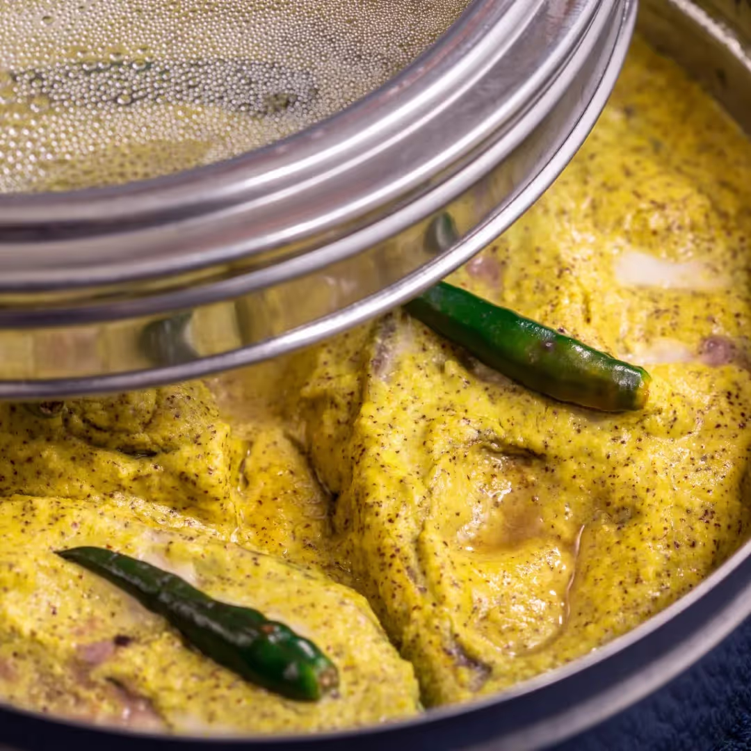 Ilish Bhapa (Hilsa steamed in mustard sauce)