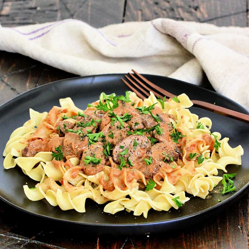 Mushroom paprikash with creamy paprika mushroom sauce served over egg noodles or spaetzle.